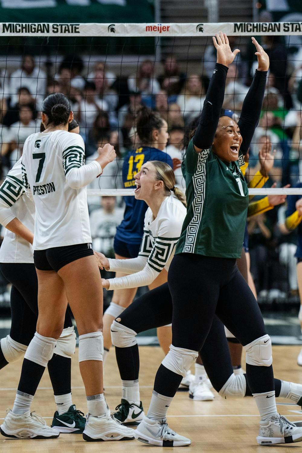 Michigan State celebrates a point against University of Michigan at the Breslin Center on Nov. 15, 2024.