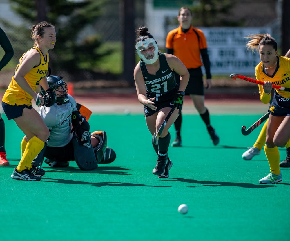 MSU midfielder Cara Bonshak, 21, chases the ball to defend MSU's goal during a game against Michigan on April 2, 2021.