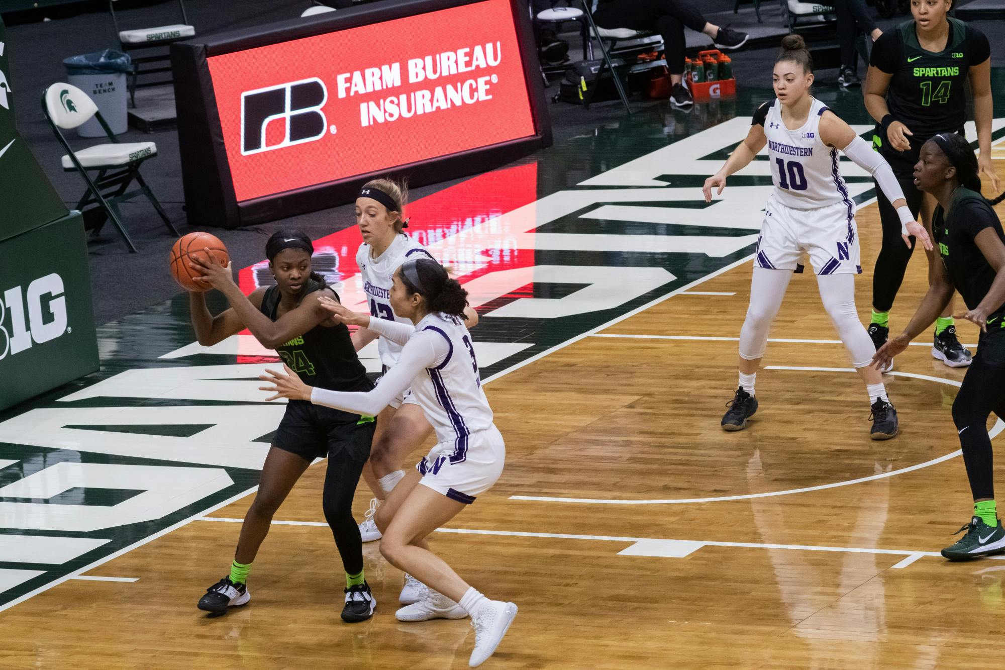 <p>Nia Clouden (24) guards the ball in the Spartans&#x27; game against Northwestern University on Feb. 7, 2021.</p>