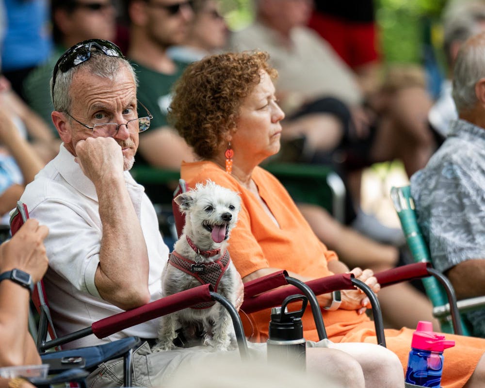 <p>An attendee of the Music and the Garden event brings their dog along to enjoy the live music from the MSU Go Music Trio in East Lansing, Mich., on June 28, 2026.</p>