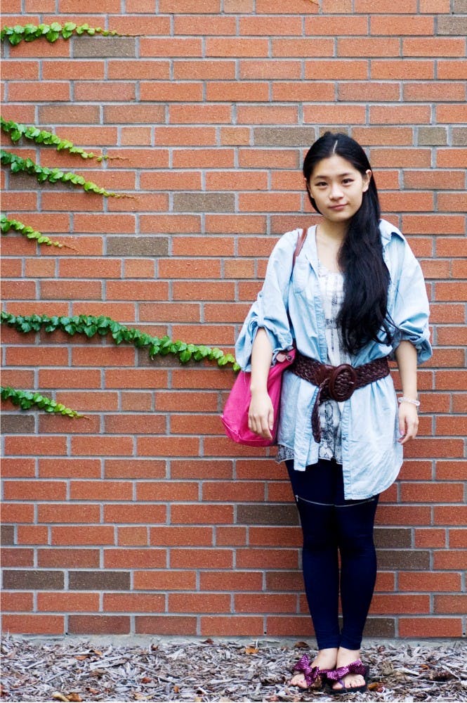 Arts and humanities sophomore Lilian Zhang poses outside of the International Center in one of her favorite outfits. Zhang said she dresses in clothing which makes her legs look longer and prefers simple color combinations. Britteny Dee/The State News