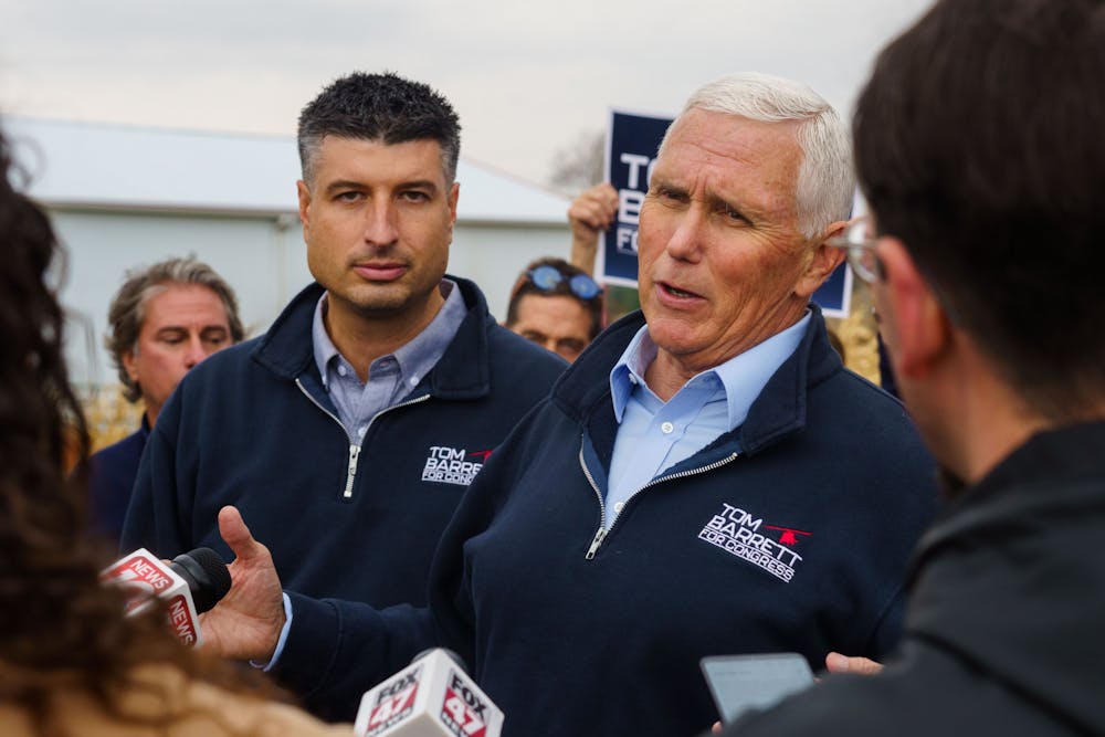 <p>Michigan State Senator Tom Barrett and Former Vice President Mike Pence address the press at a rally supporting Barrett’s US Representative campaign at Country Mill farm on Nov. 4, 2022.</p>