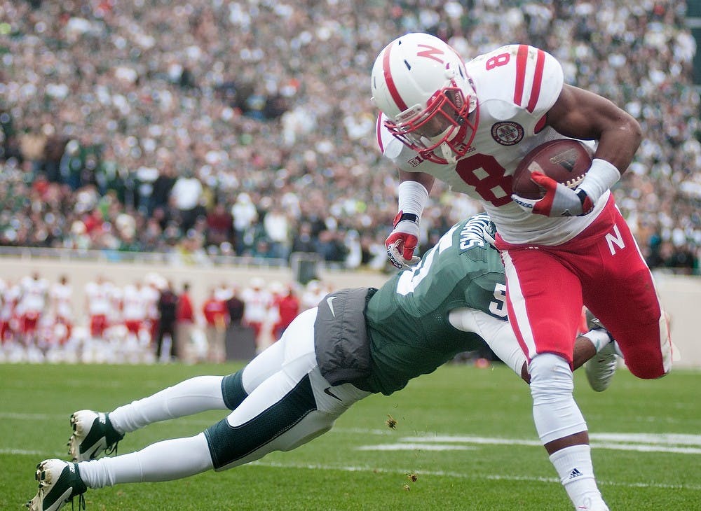 Senior cornerback Johnny Adams attempts to tackle Nebraska's running back Ameer Abdullah unsuccessfully during the game Nov. 3, 2012, at Spartan Stadium. The Spartans lost in the last six seconds of the game with a final score of 28-24. Natalie Kolb/The State News