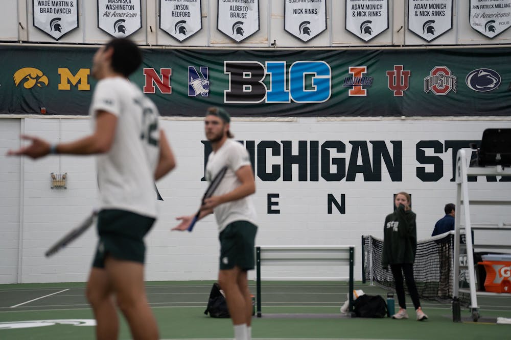 <p>Freshman Ozan Baris and junior Reed Crocker move to get back in position during their doubles match against Michigan at the MSU Tennis Center on March 30, 2023. The Spartans lost to the Wolverines 6-1.</p>