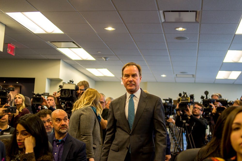 
Michigan Attorney General Bill Schuette walks past media into the Kelley Library for the press conference concerning the investigation into MSU on Jan 27, 2018 at 525 W. Ottawa in Lansing.