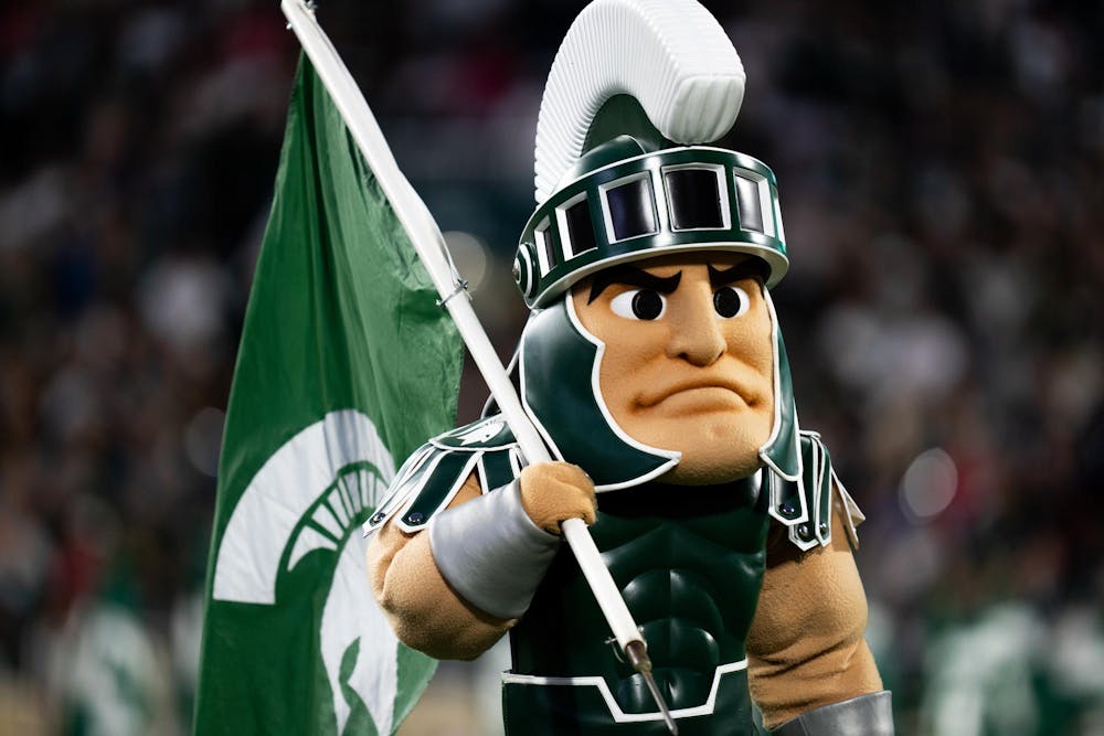 <p>Sparty, the Michigan State University mascot carries an MSU flag prior to a football game against the Ohio State Buckeyes at Spartan Stadium on Sept. 28, 2024. Despite a competitive first half, the Spartans fell 38-7 to the Buckeyes.</p>