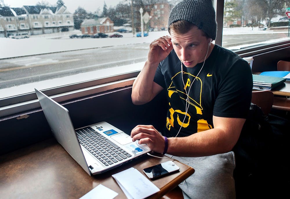 	<p>Psychology junior Cody Thomas adjusts his headphones before studying at Biggby Coffee, 270 W. Grand River Ave., March 19, 2013. Thomas was diagnosed with attention deficit hyperactivity disorder, or <span class="caps">ADHD</span>. Justin Wan/The State News</p>