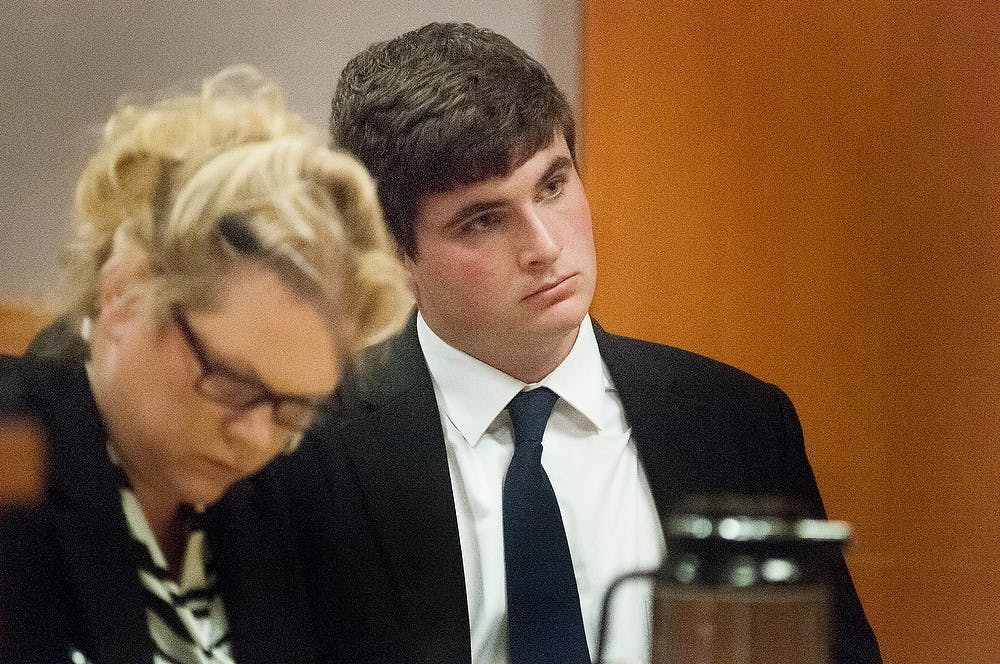 Advertising junior Brandon Carmack sits and watches witness testimony Wednesday at City Hall, 410 Abbot Road, as the witness recalls what happened during the early hours of Aug. 28, 2012. Katie Stiefel/ State News