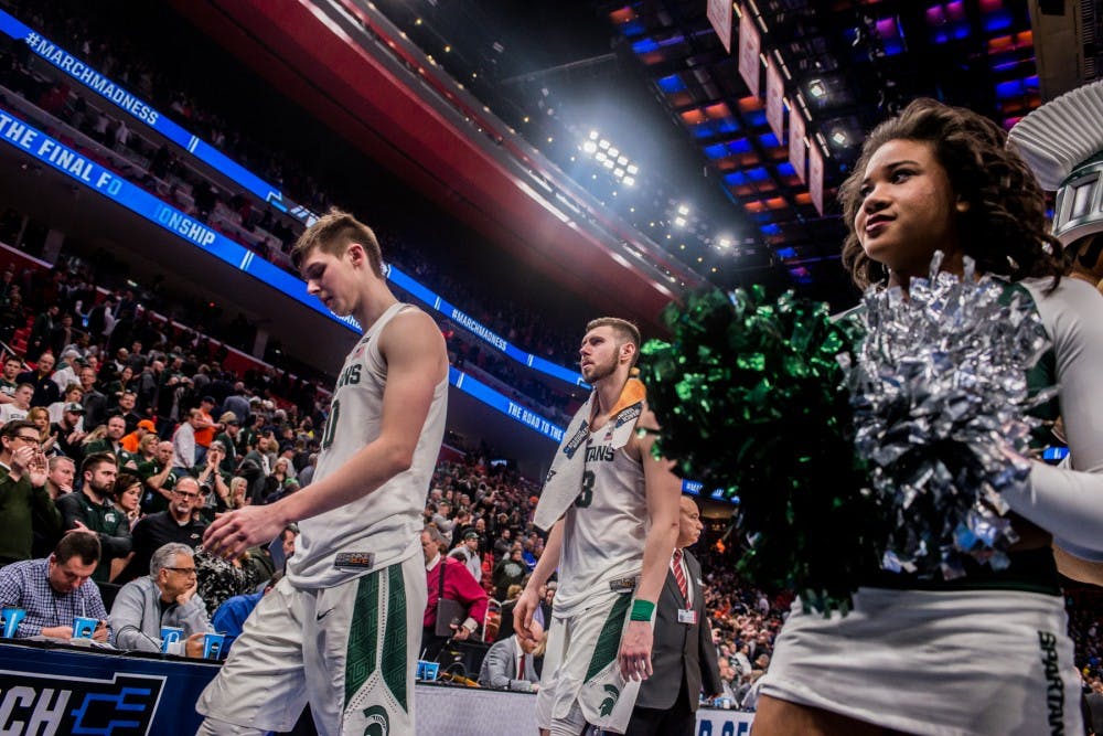 <p>Spartans exit the court after the loss against Syracuse on March 18, 2018 at Little Caesars Arena in Detroit. The Spartans fell to the Orange, 55-53 ending their NCAA journey.&nbsp;</p>