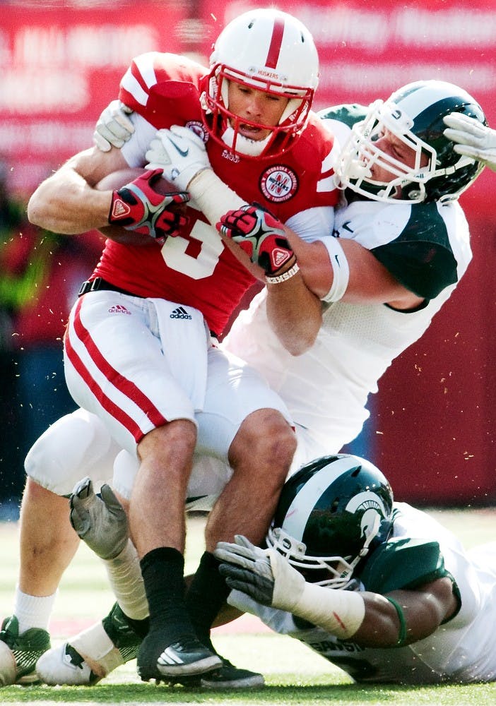 Sophomore linebacker Max Bullough tackles Nebraska quarterback Taylor Martinez on a run. The Cornhuskers ran for 190 yards and defeated the Spartans, 24-3, on Saturday afternoon at Memorial Stadium in Lincoln, Neb. Josh Radtke/The State News