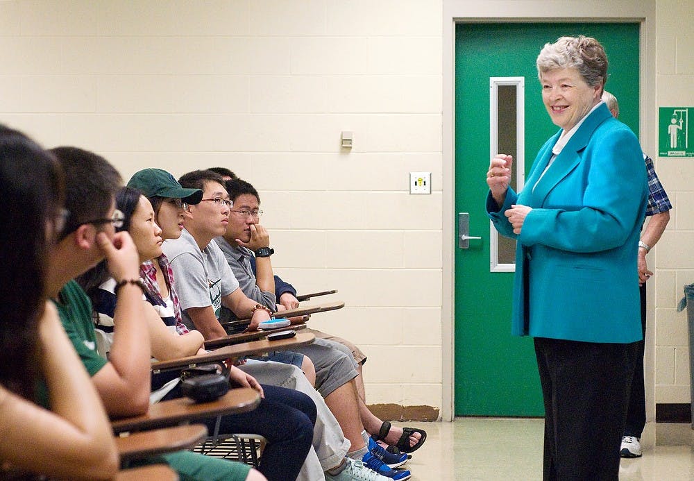 <p>President Lou Anna K. Simon speaks to students in the MSU-China Turf Grass Program on Wednesday at the Plant and Soil Sciences Building. The 72 Chinese students are at MSU for two weeks before starting internships across the country. Kat Petersen/The State News</p>