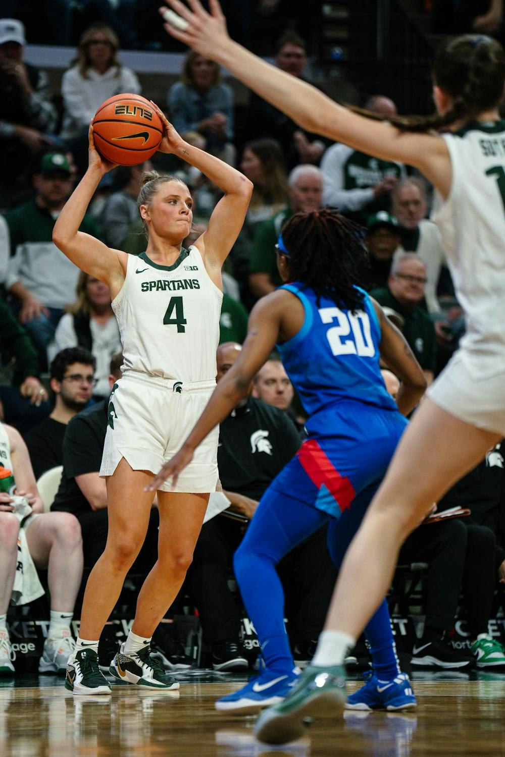 <p>Michigan State junior guard Theryn Hallock (4) attempts to pass the ball to a teammate at the Breslin Center on Dec. 8, 2024. The Spartans won 89-61 against the Blue Demons of DePaul University, starting the season 9-0 for the first time in program history.</p>