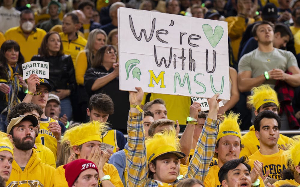 <p>A Michigan fan shows their support for Michigan State ahead of their game on Saturday, Feb. 18, 2023, at the Crisler Center. The rivalry matchup was MSU’s first game back after the mass shooting on Feb. 13. The Wolverines ultimately beat the Spartans, 84-72.</p>