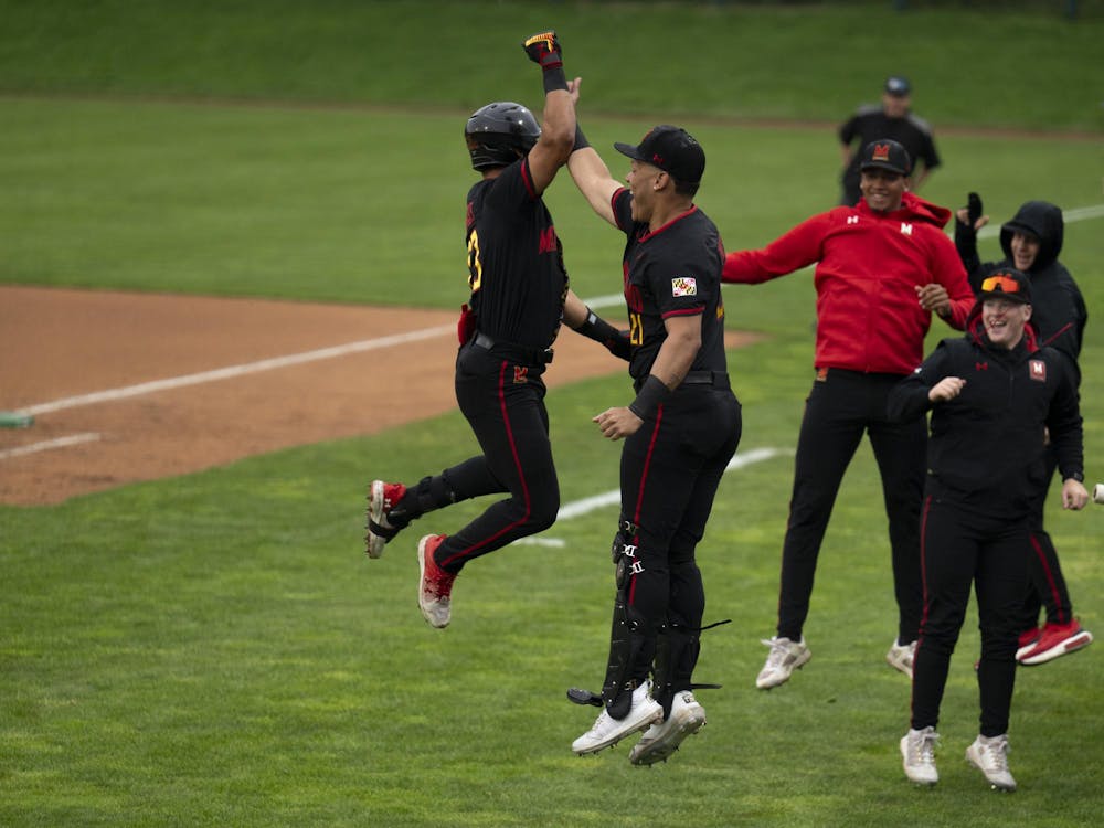 <p>Maryland freshman Bud Coombs homers to left center at Jeff Ishbia Field at McLane Baseball Stadium in East Lansing, Mich., on Friday, April 24, 2026. </p>