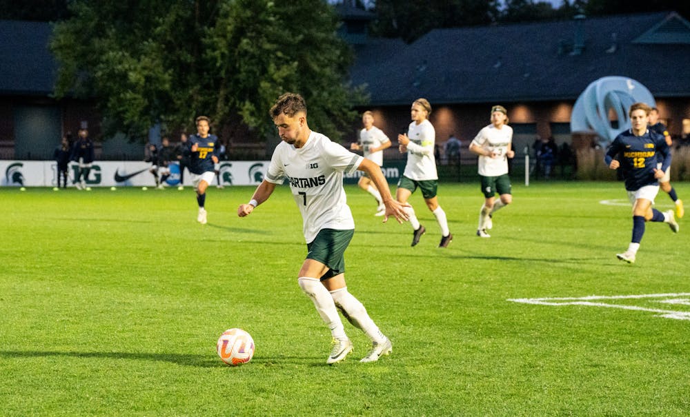 <p>Michigan State junior midfielder Vedad Kovac (7) dribbles the ball at DeMartin Stadium on Sept. 27, 2022. Spartans defeated the Wolverines 2-0. </p>