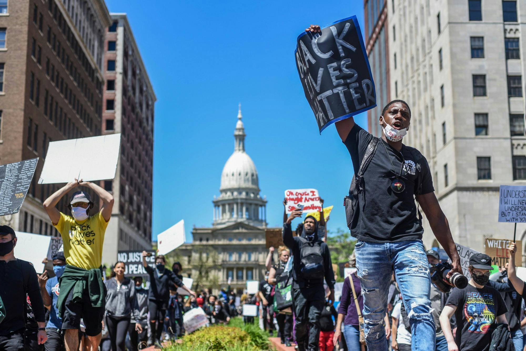 People march at the protest in Lansing against police brutality May 31, 2020.