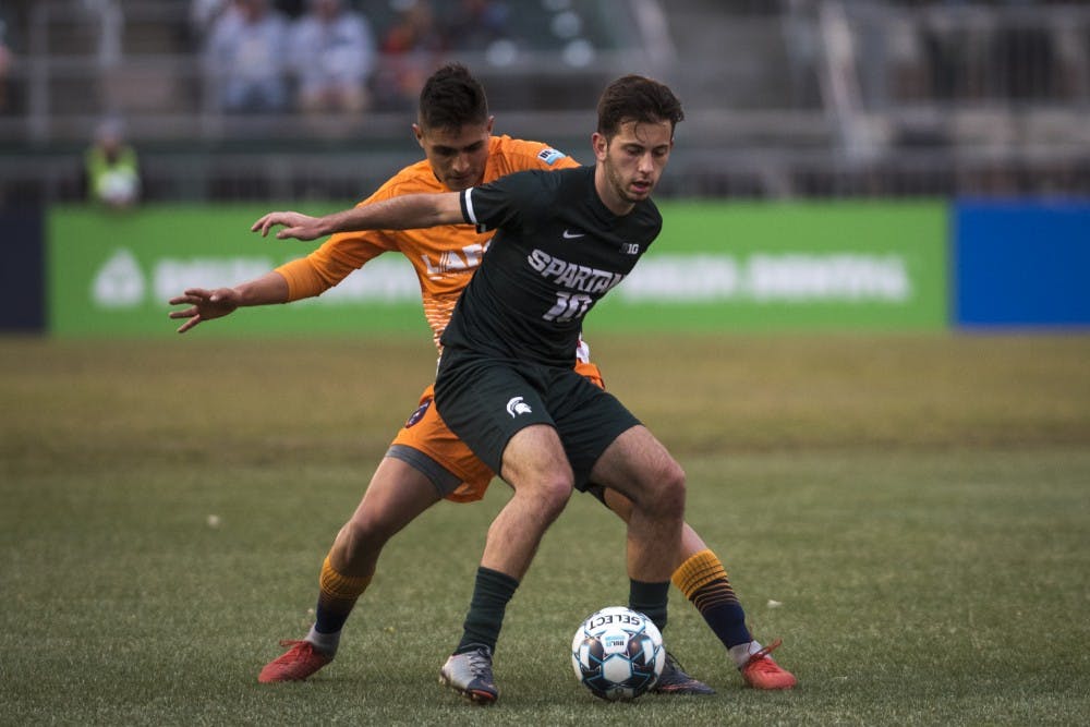 Junior midfielder Giuseppe Barone (10) handles the ball during the first half of the Capital Cup against Lansing Ignite FC at Cooley Law School Stadium in Lansing on Tuesday, April 16, 2019. (Nic Antaya/The State News)