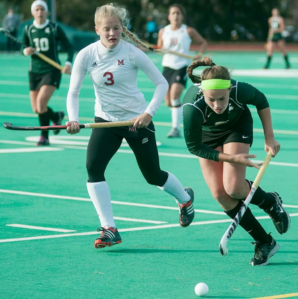 	<p>Junior forward Abby Barker runs the ball away from Miami (Ohio) back Shannon Regan on Nov. 13, 2013, at Ralph Young Field. The Spartans defeated the Redhawks, 3-0, during the first round of the <span class="caps">NCAA</span> tournament. Danyelle Morrow/The State News</p>