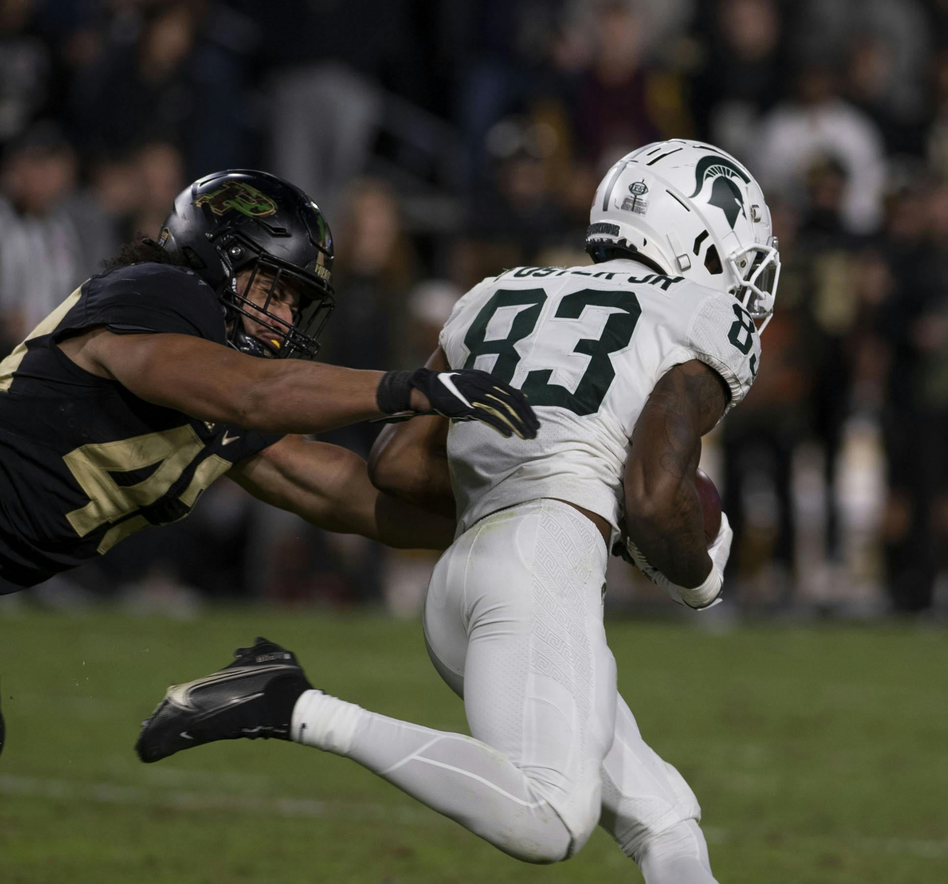 <p>Purdue&#x27;s Kieren Douglas (43) catches up to Spartan sophomore wide receiver Montorie Foster (83) in the MSU&#x27;s match against the Boilermakers at Ross-Ade Stadium in West Lafayette on Saturday, Nov. 6, 2021.</p>