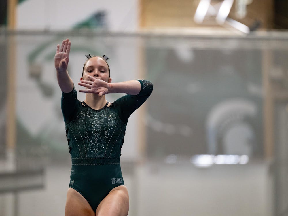 Freshman Isabel Biro performs her routine on the balance beam during the MSU tri-meet at Jenison Field House on Sunday, Feb. 15, 2026.