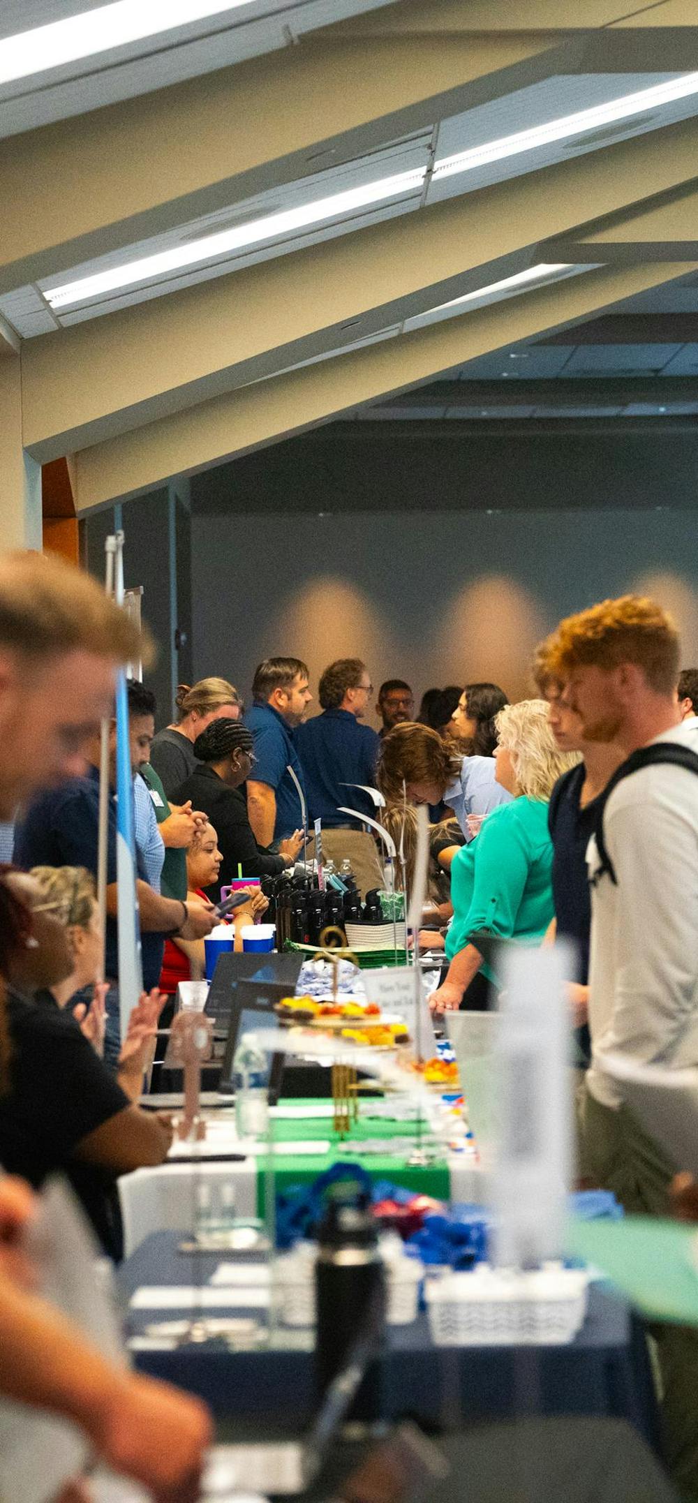 Students talking to employers at the MSU Local Job and Internship Fair held at the Spartan Stadium Office Tower on Sep 7, 2023. 