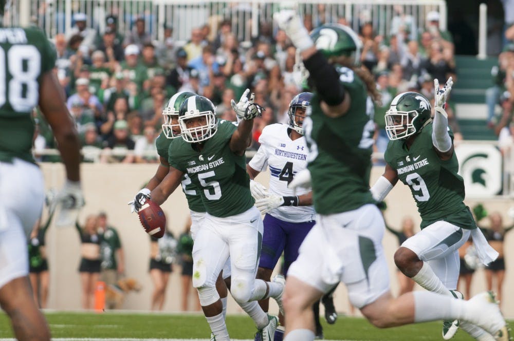 Sophomore linebacker Andrew Dowell (5) celebrates after picking up a fumble during the game against Northwestern on Oct. 15, 2016 at Spartan Stadium.  The Spartans were defeated by the Wildcats, 54-40.  