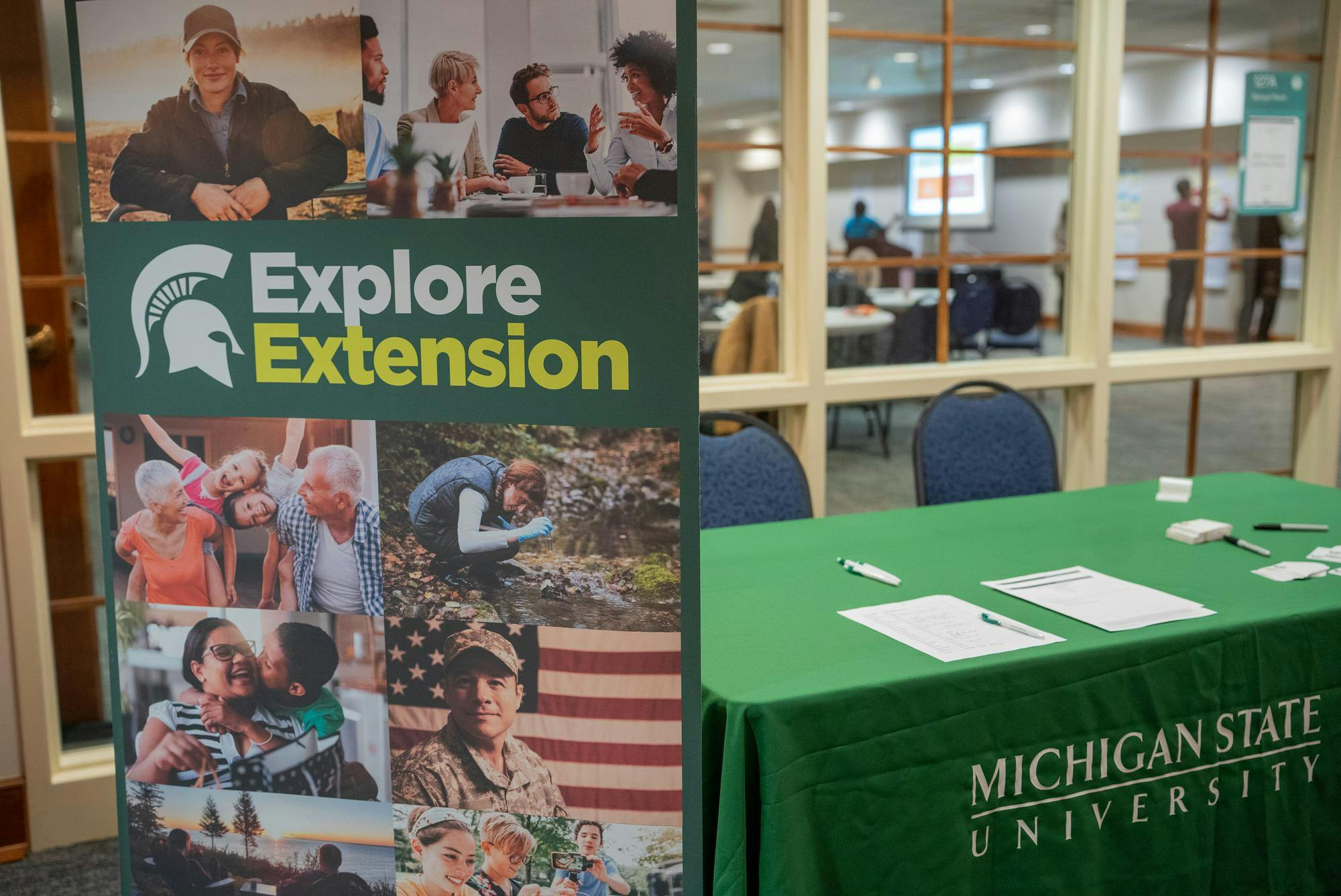 The check-in table of the MSU Extension’s East Lansing public listening session at the Hannah Community Center on Nov. 29, 2023. 