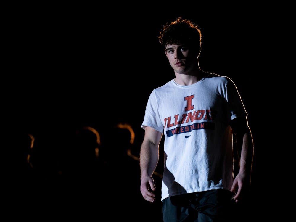 <p>Illinois’ Colin Kelly (174) walks toward the mat ahead of his bout against Michigan State during a dual meet at Jenison Field House in East Lansing on Friday, Jan. 16, 2026.</p>