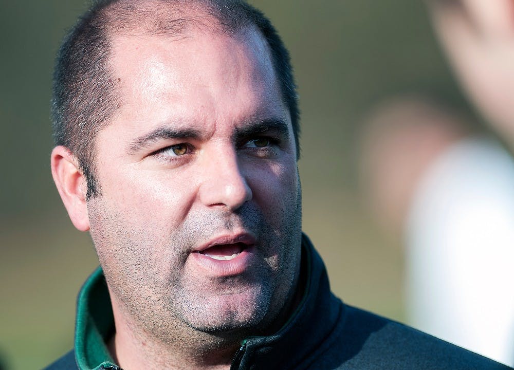 <p>Head coach Damon Rensing talks with reporters after the game Thursday, Nov. 15, 2012, at DeMartin Stadium at Old College Field. The Spartans defeated Cleveland State, 2-1, in the first round of the NCAA Tournament. Adam Toolin/The State News</p>