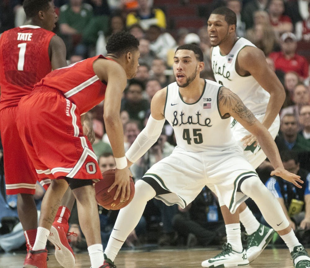 Junior guard Denzel Valentine guards Ohio State freshman guard D'Angelo Russell on March 13, 2015, during the game against Ohio State at the Big Ten Tournament at United Center in Chicago. The Spartans defeated the Buckeyes, 76-67. State News File Photo