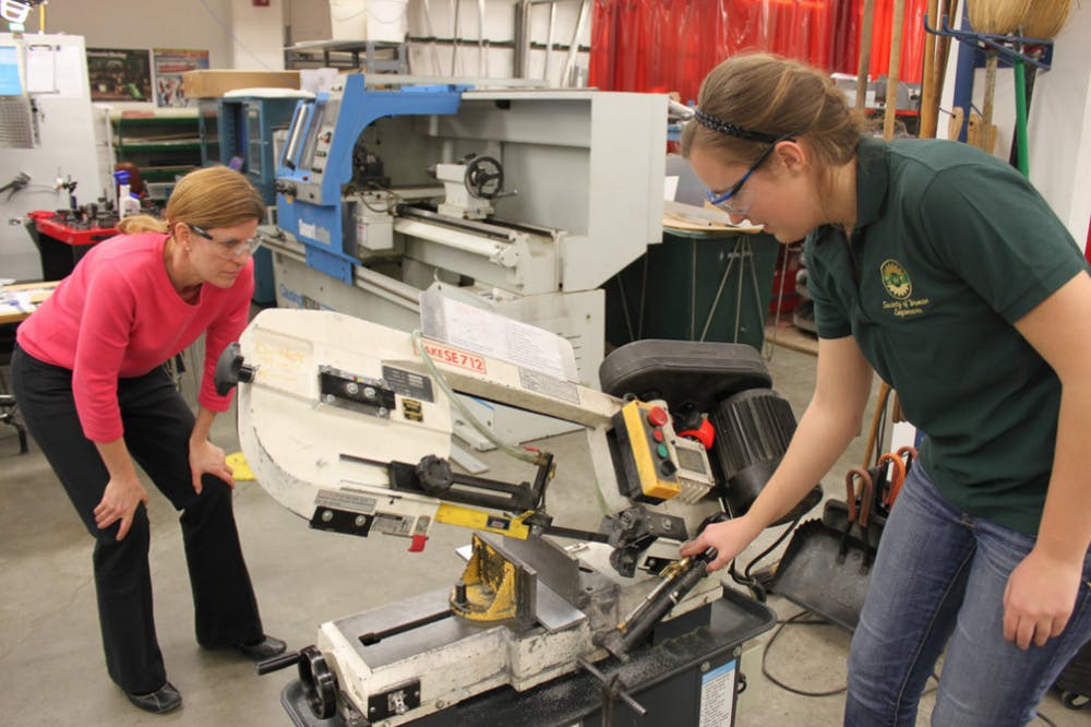 <p>Laura Gumpper and Tammy Reid Bush hosted a workshop in the Mechanical Machine Shop on Jan. 28, 2015, for women engineering students who wanted more hands-on time in the machine shop. Photos by Patricia Mroczek, MSU College of Engineering.</p>