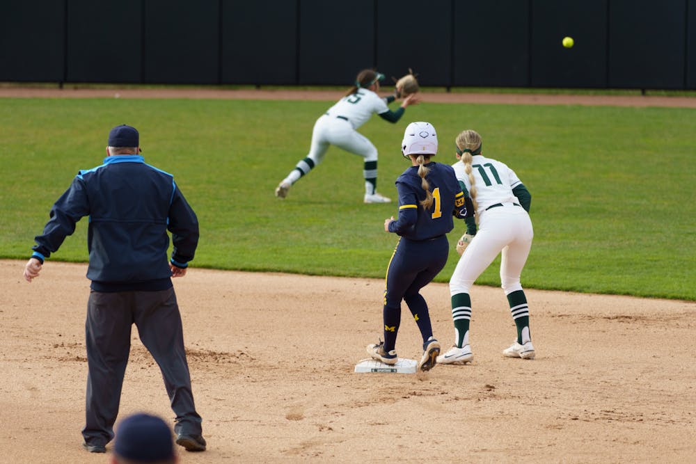 <p>Michigan freshman Ellie Sieler (1) makes it safely to second base. Michigan State lost 3-0 to Michigan at the Secchia Stadium, on April 19, 2022.</p>
