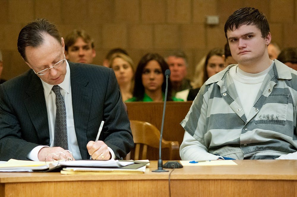 	<p>Okemos resident Connor McCowan sits next to his attorney, Chris Bergstrom, during the preliminary exam of the fatal stabbing of <span class="caps">MSU</span> student Andrew Singler on April 18, 2013, at Ingham County District Judge Donald Allen&#8217;s courtroom in Mason, Mich. McCowan is standing trial for allegedly killing 23-year-old Singler in February. Natalie Kolb/The State News</p>