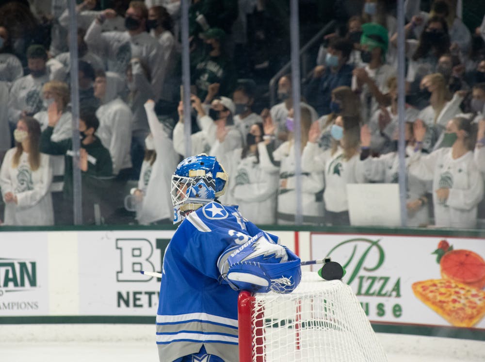 <p>Air Force&#x27;s goalie Alex Schilling (33) relaxes on the goal as Michigan State fans cheer against the glass during Michigan State&#x27;s loss to Air Force on Oct. 8, 2021.</p>