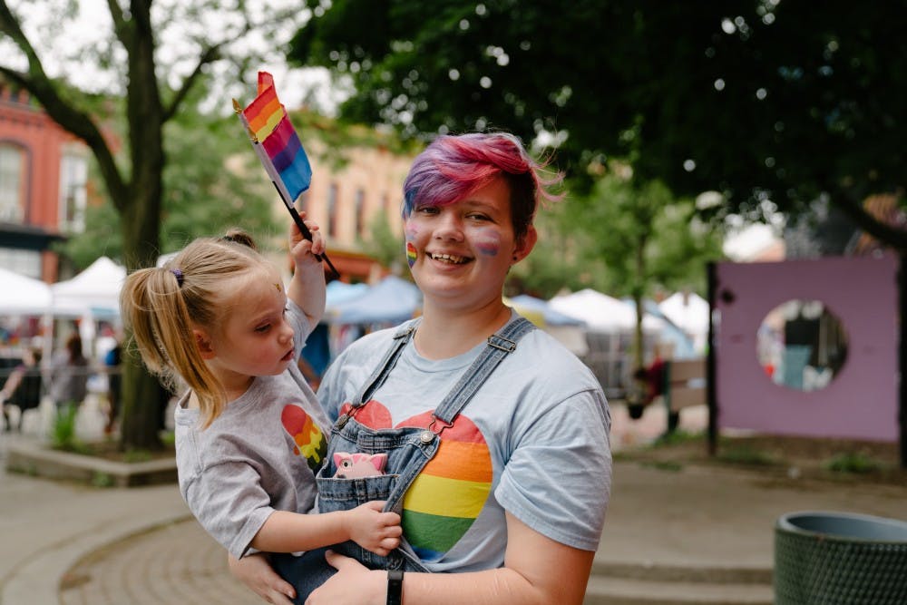 <p>Lansing resident Felix Partridge and his 2-year-old sister Vibeke Kongstad attend Pride in Old Town on Saturday, June 15, 2019.</p>
