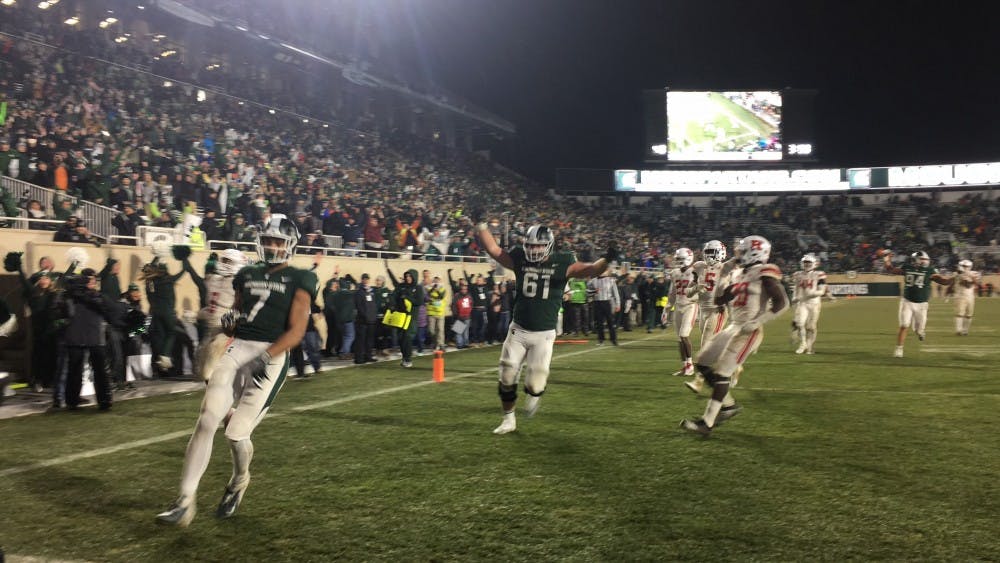 <p>Sophomore wide receiver Cody White (7) runs into the end zone during Michigan State's game against Rutgers at Spartan Stadium on Nov. 24, 2018. The Spartans beat the Scarlet Knights, 14-10.&nbsp;</p>