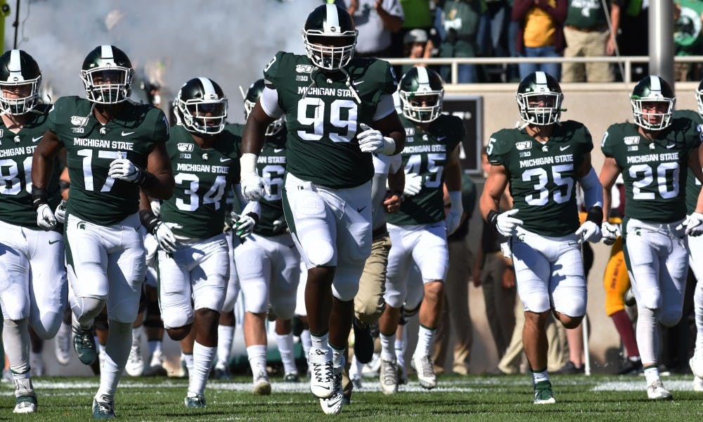 <p>Michigan State runs on the field before kickoff ready to play Arizona State. The Spartans fell to the Sun Devils 10-7 at Spartan Stadium on Sept. 14, 2019.</p>