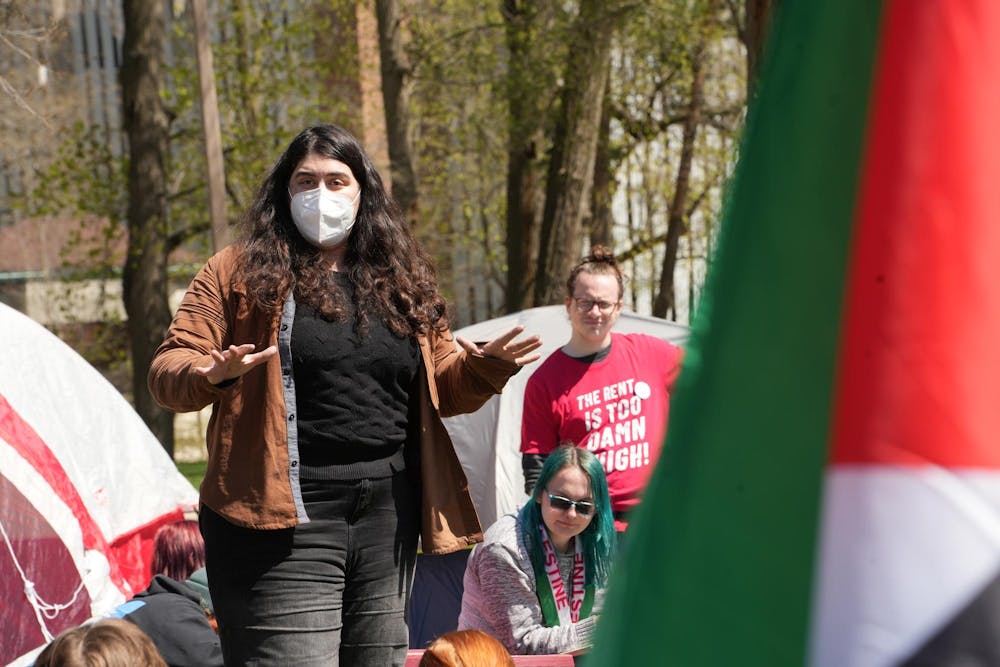 <p>A student protester gives an impassioned speech during a Gaza solidarity encampment in People’s Park on April 25, 2024.</p>