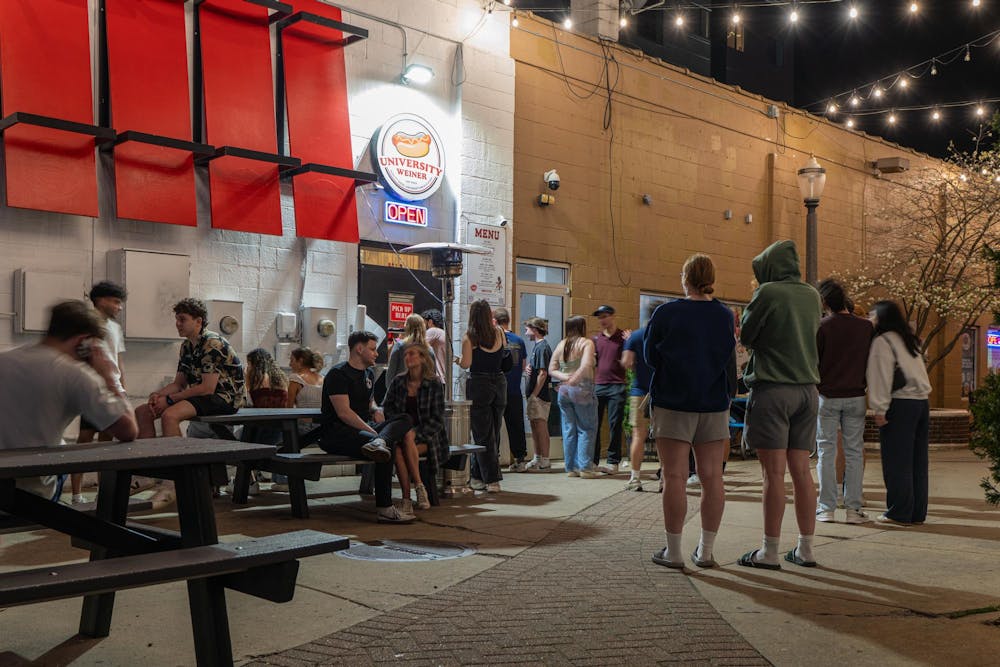 <p>Michigan State University students wait for their hot dog in an alley way outside of University Weiner in East Lansing, MI on April 17, 2026.</p>
