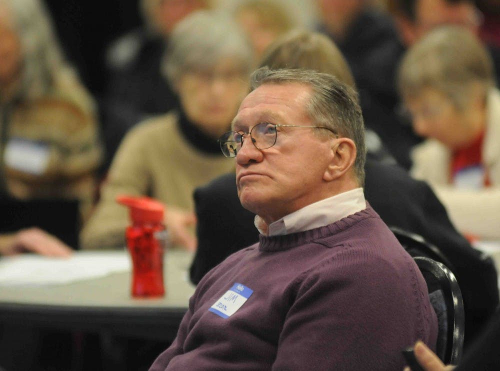 <p>East Lansing resident Jim Secor ponders the future of the East Lansing budget at a community meeting on Jan. 10, 2018, at the Hannah Community Center. (State News | Annie Barker)</p>
