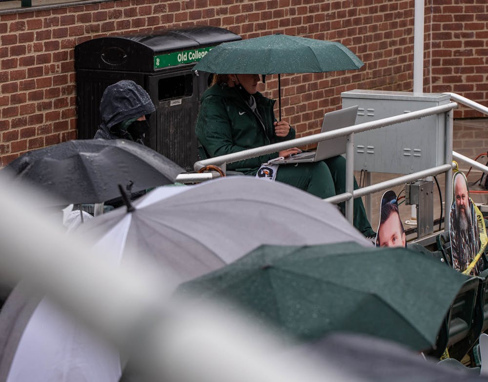 Spectators still attend the game regardless of the rainy weather, coming prepared with umbrellas and rain ponchos. The Boilermakers made a seven-run comeback in the sixth inning to top the Spartans 9-6 at Secchia Stadium on April 24, 2021.