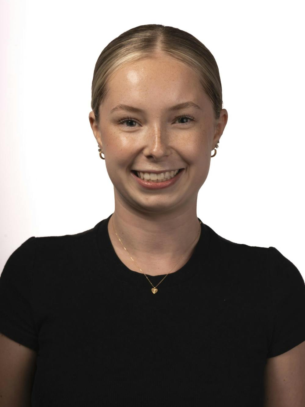 A staff member poses for a headshot at The State News office on Thursday, Sept. 3, 2026, in East Lansing, Michigan.