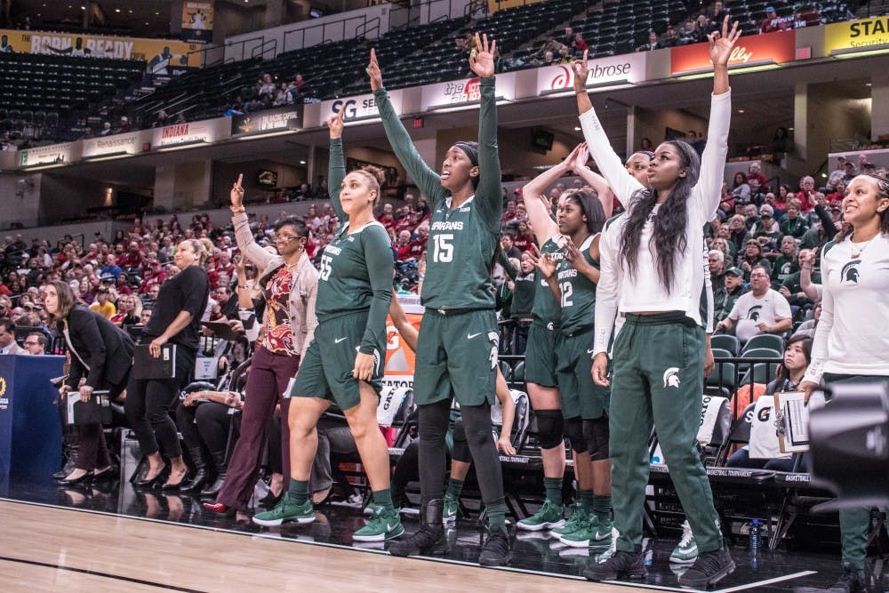 <p>The Spartans' bench watches as sophomore guard Taryn McCutcheon attempts a three-pointer during the game against Indiana on March 1, 2018 at Bankers Life Fieldhouse. The Spartans fell to the Hoosiers, 111-109, in 4OT.</p>