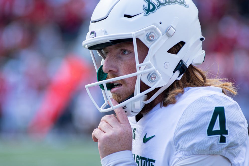 <p>Graduate student Matt Coghlin walks off the field after drilling another field goal. The Spartans found a way to hold on against the Hoosiers with a 20-15 win, scraping to their first 7-0 start since 2015 on Oct. 16, 2021. Coghlin was responsible for eight of their points, with two field goals and two extra-points.</p>