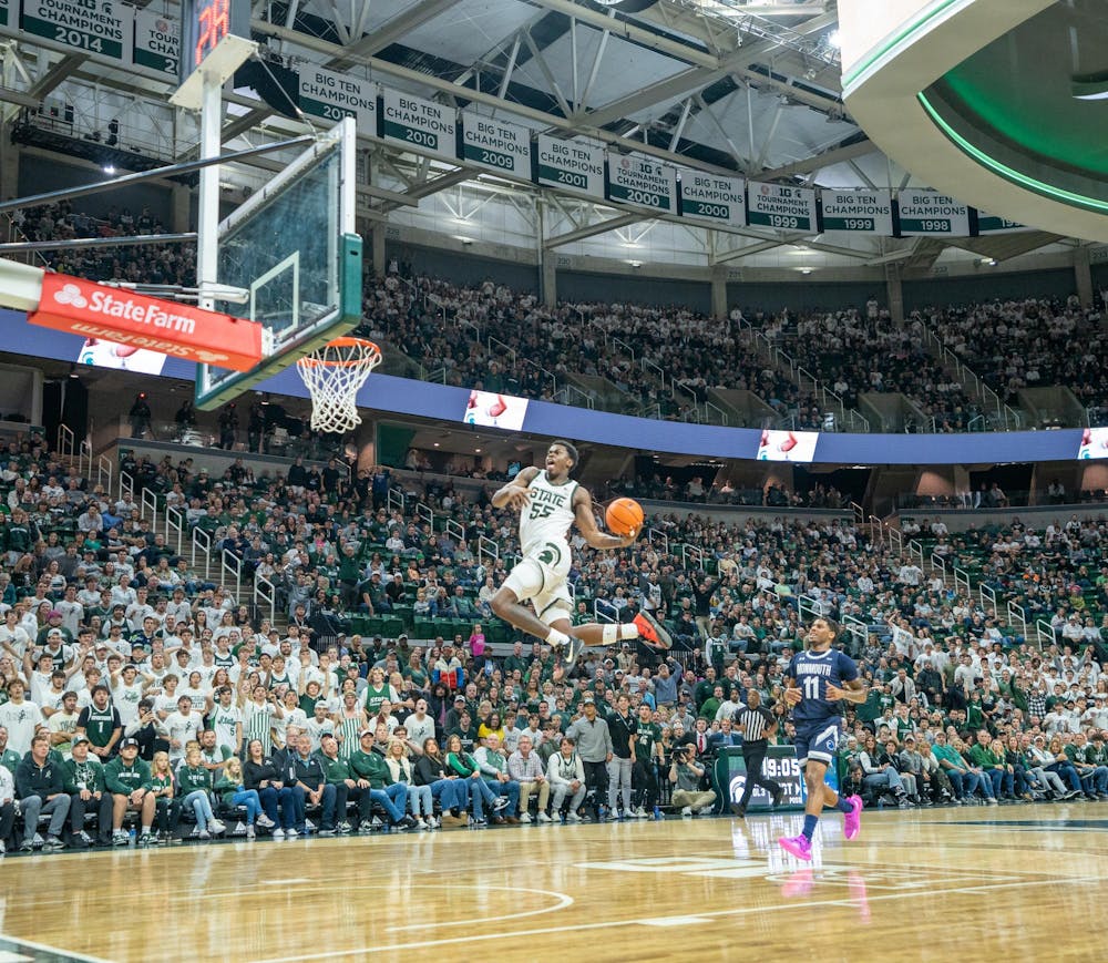 <p>MSU sophomore forward Coen Carr (55) dunks during their season opener against Monmouth University at the Breslin Center on Nov. 4, 2024.</p>