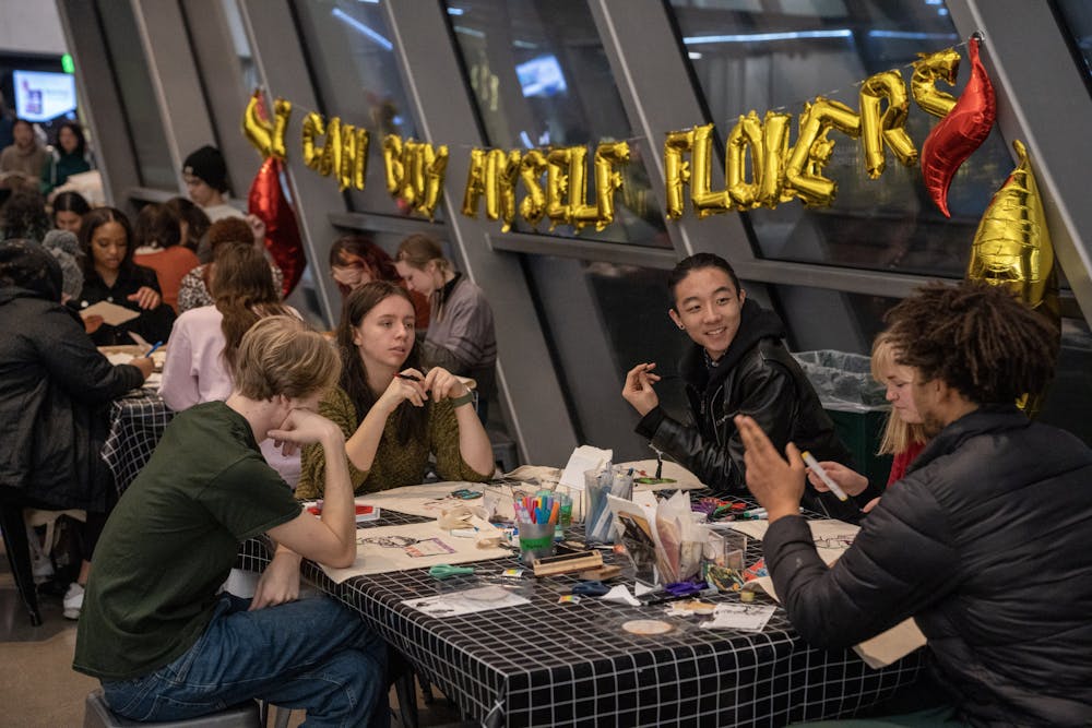 <p>Students attending the Anti-Valentine's Day Party at the Broad Museum decorate their tote bags and craft anti-valentines day cards, on Feb. 10, 2023.</p>