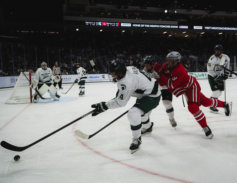<p>MSU sophomore defenseman Colin Ralph (4) fights for the puck vs. OSU at the Munn Ice Arena in East Lansing, MI, on Feb. 27, 2026.</p>