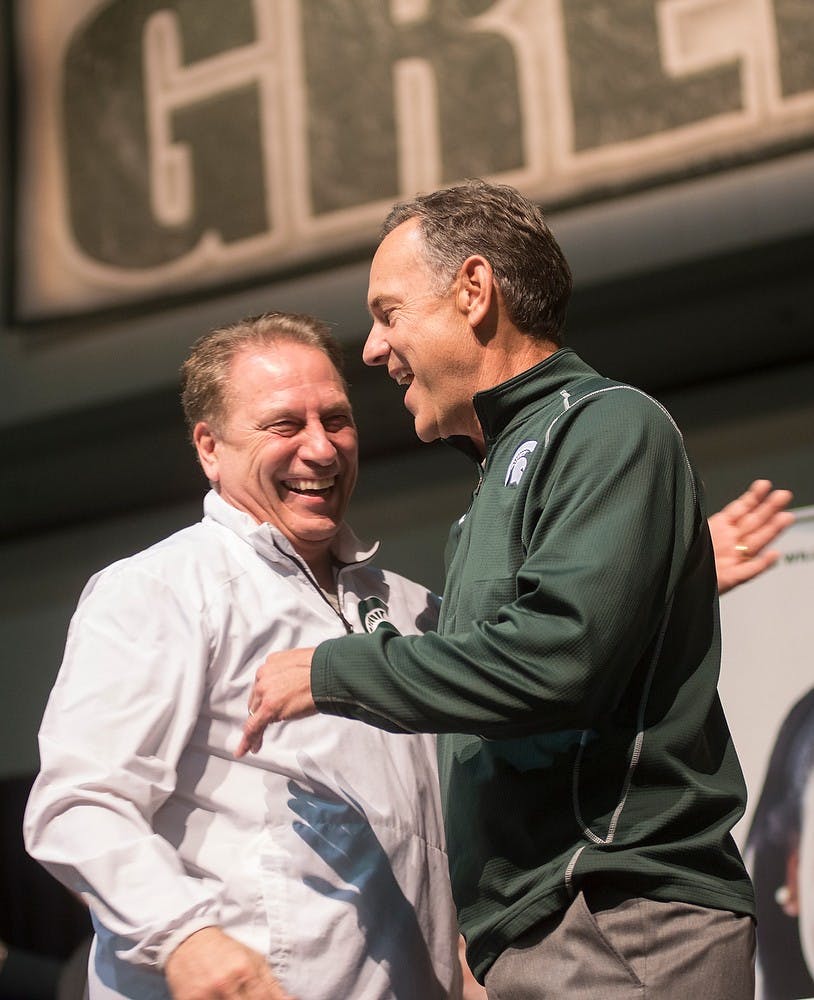 <p>Football head coach Mark Dantonio welcomes Men's basketball head coach Tom Izzo to the stage April 3, 2015, during a final four Spartan pep rally at the Indiana Convention Center , 100 S. Capitol Ave., in Indianapolis, Indiana. Erin Hampton/The State News</p>