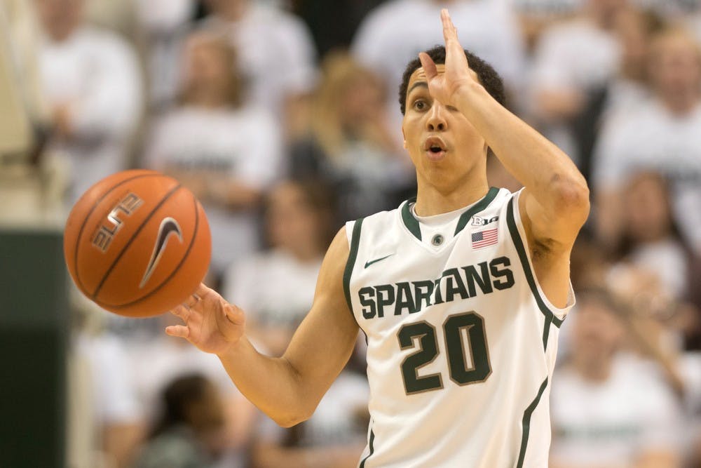 	<p>Junior guard Travis Trice motions to the team Feb. 13, 2014, at Breslin Center. The Spartans defeated the Wildcats, 85-70. Julia Nagy/The State News</p>