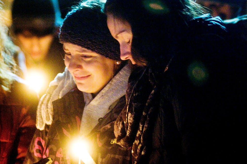 	<p>Communication sophomore Johanna Jelenek is embraced by biochemistry sophomore Audrey DeYoung as the two reflect on the death of their close friend Carly Glynn on Feb. 12, 2012. Glynn passed away Friday Feb. 10 at 19 years old. State News File Photo</p>